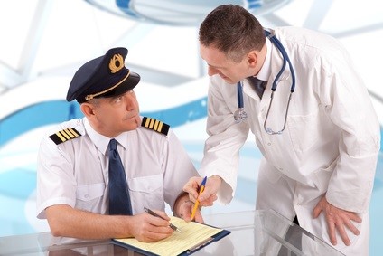 Aeromedical Exam Airplane pilot during medical exam with doctor filling in papers.